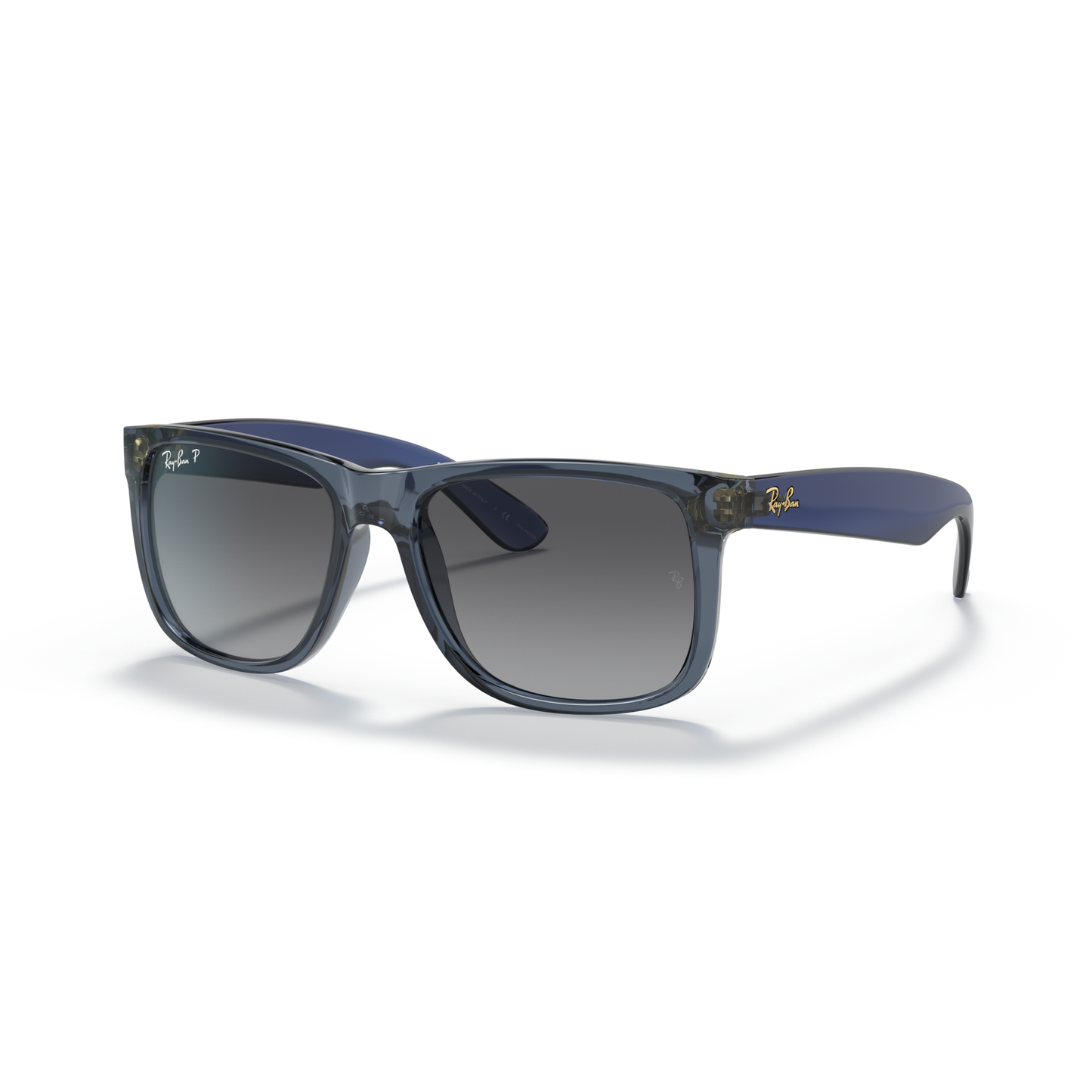 Sunglasses with blue frames and dark lenses on a white background Polished Transparent Blue + Gradient Grey Polarised