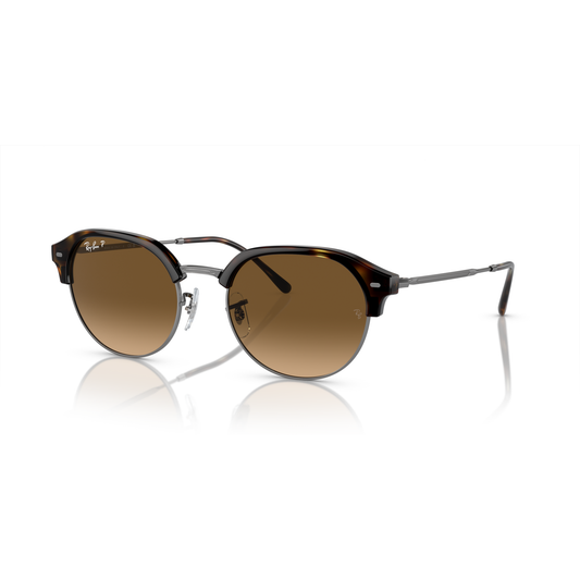 Brown sunglasses with a reflective surface on a white background Polished Havana on Gunmetal + Brown Gradient Polarised