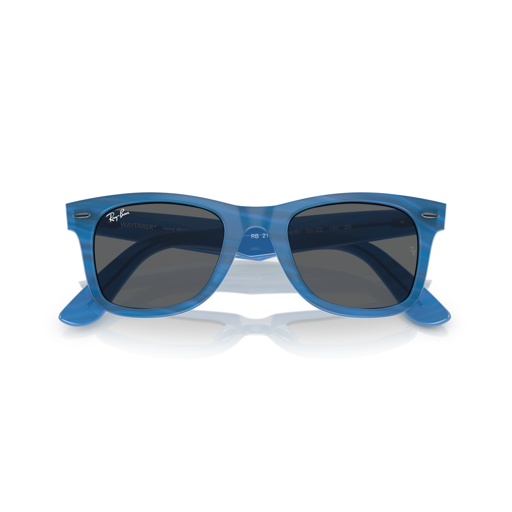 Blue sunglasses with dark lenses on a white background Polished Photo Striped Blue + Dark Grey