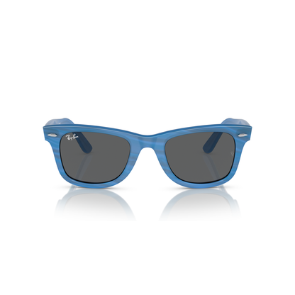 Blue sunglasses with dark lenses on a white background Polished Photo Striped Blue + Dark Grey