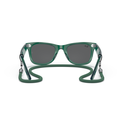 Green sunglasses with a flexible neck strap on a white background Polished Transparent Green + Dark Grey