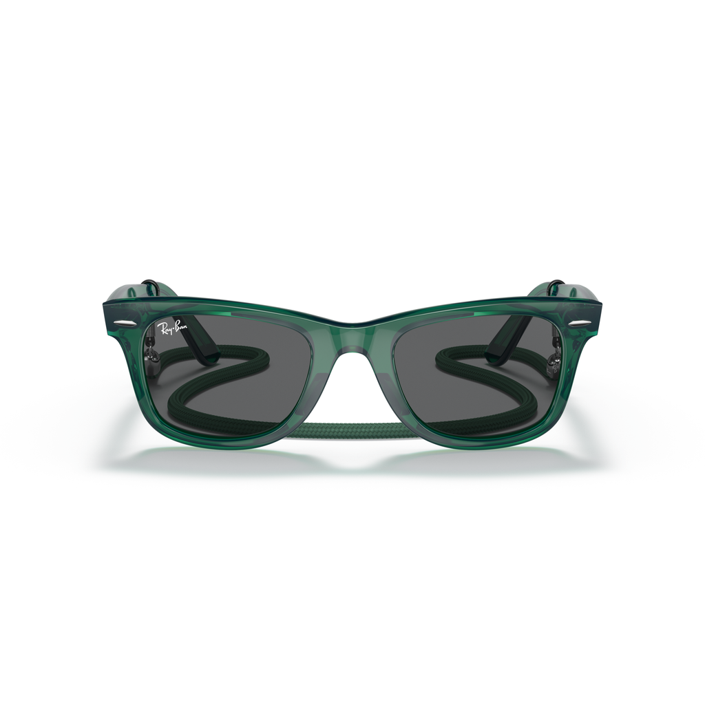 Green sunglasses with a reflective surface on a white background Polished Transparent Green + Dark Grey