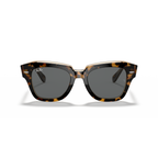 Tortoiseshell sunglasses with dark lenses on a white background Polished Havana on Transparent Brown + Dark Grey