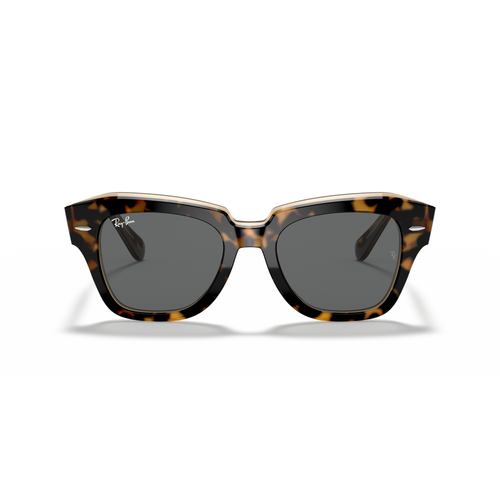 Tortoiseshell sunglasses with dark lenses on a white background Polished Havana on Transparent Brown + Dark Grey