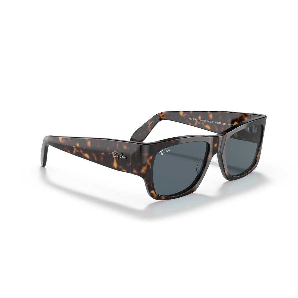 Tortoiseshell sunglasses with dark lenses on a white background Polished Tortoise + Blue