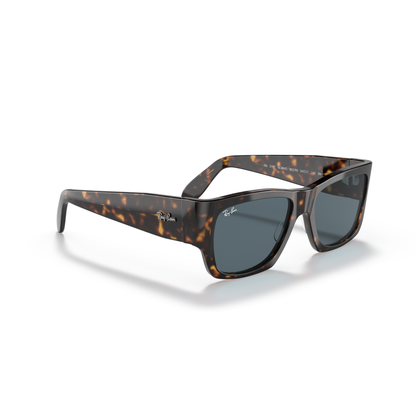 Tortoiseshell sunglasses with dark lenses on a white background Polished Tortoise + Blue