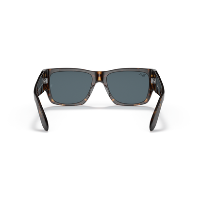 Sunglasses with tortoiseshell frame and dark lenses on a white background Polished Tortoise + Blue