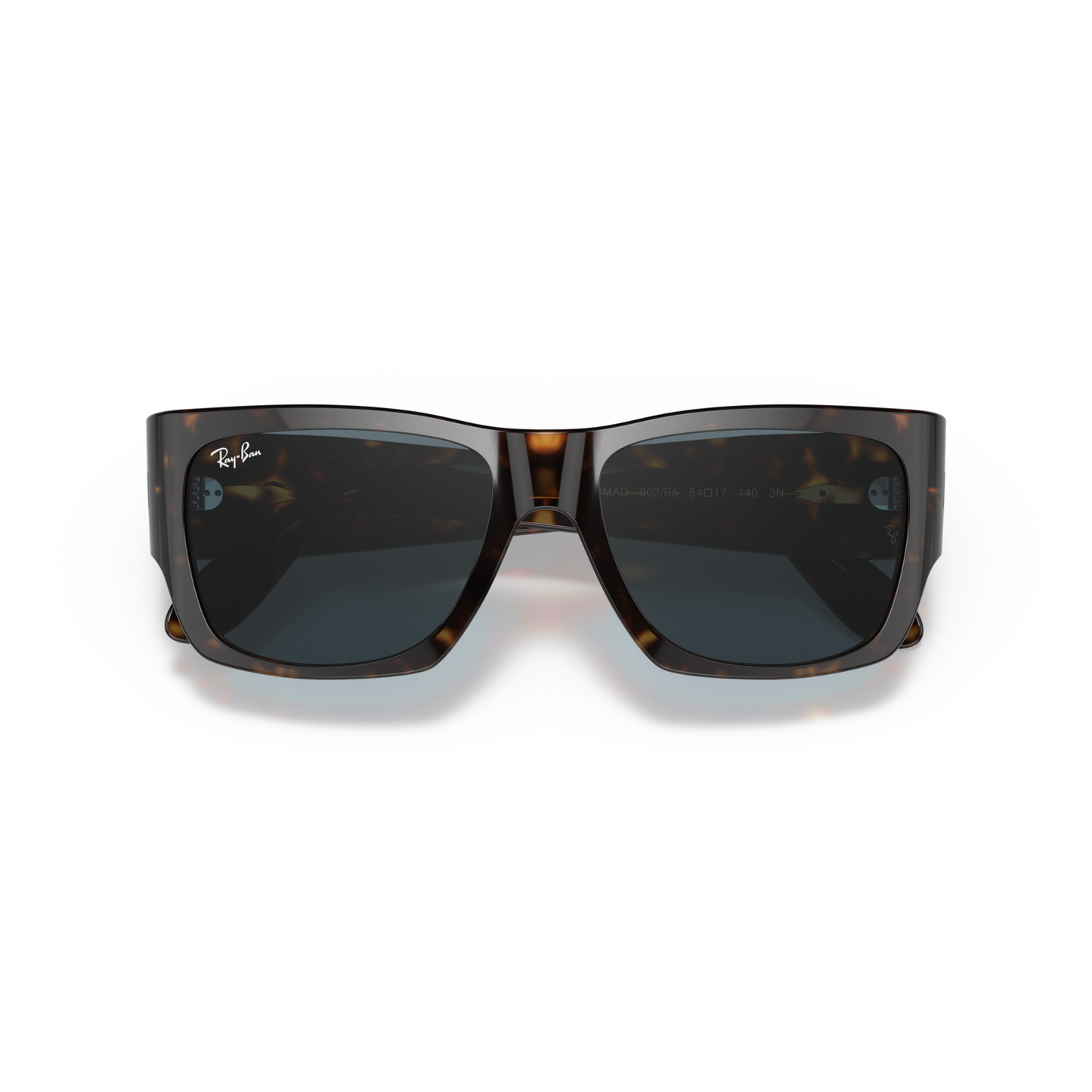 Sunglasses with tortoiseshell frame and dark lenses on a white background Polished Tortoise + Blue