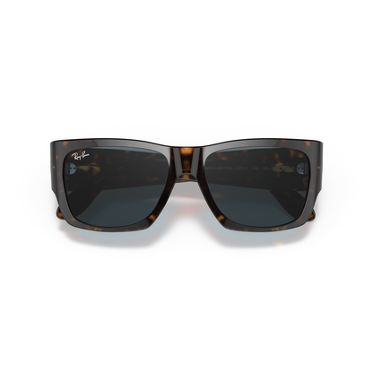 Sunglasses with tortoiseshell frame and dark lenses on a white background Polished Tortoise + Blue