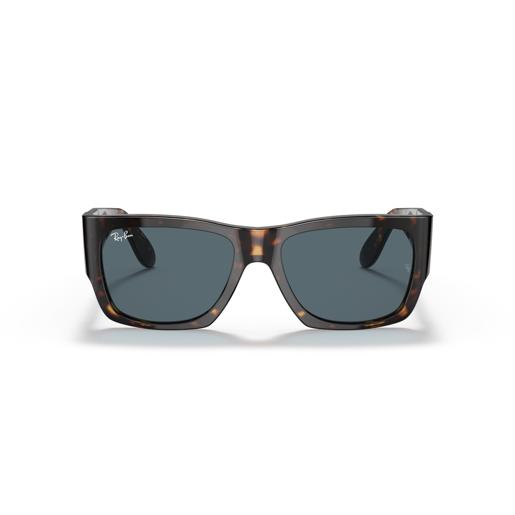 Sunglasses with tortoiseshell frame and dark lenses on a white background Polished Tortoise + Blue
