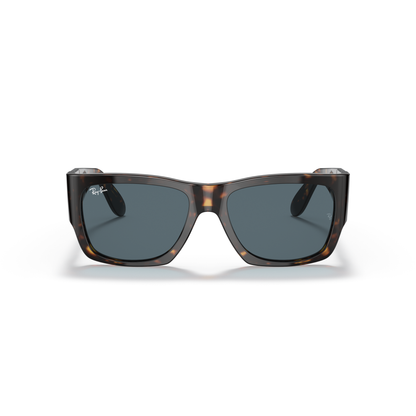Sunglasses with tortoiseshell frame and dark lenses on a white background Polished Tortoise + Blue