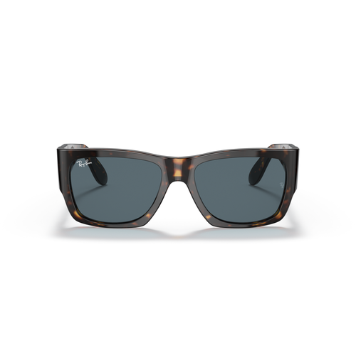 Sunglasses with tortoiseshell frame and dark lenses on a white background Polished Tortoise + Blue