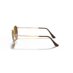 Sunglasses with gold frame and brown lenses on a white background Polished Light Bronze + Pink/Brown Gradient