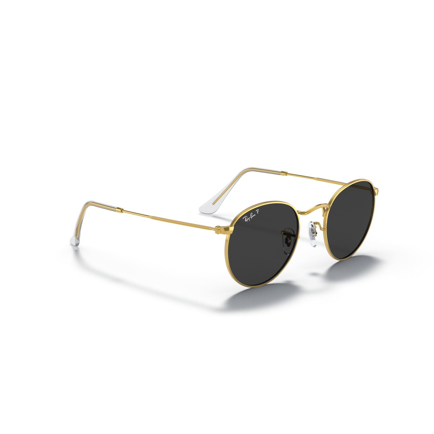 Gold-framed sunglasses with dark lenses on a white background Polished Gold + Black Polarised