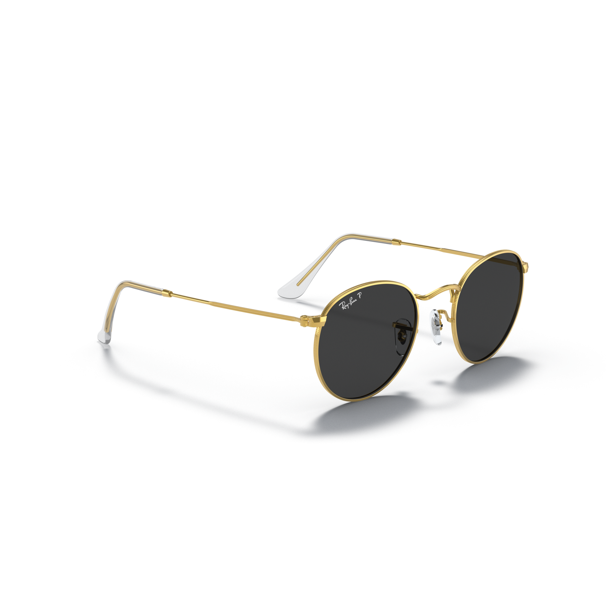 Gold-framed sunglasses with dark lenses on a white background Polished Gold + Black Polarised