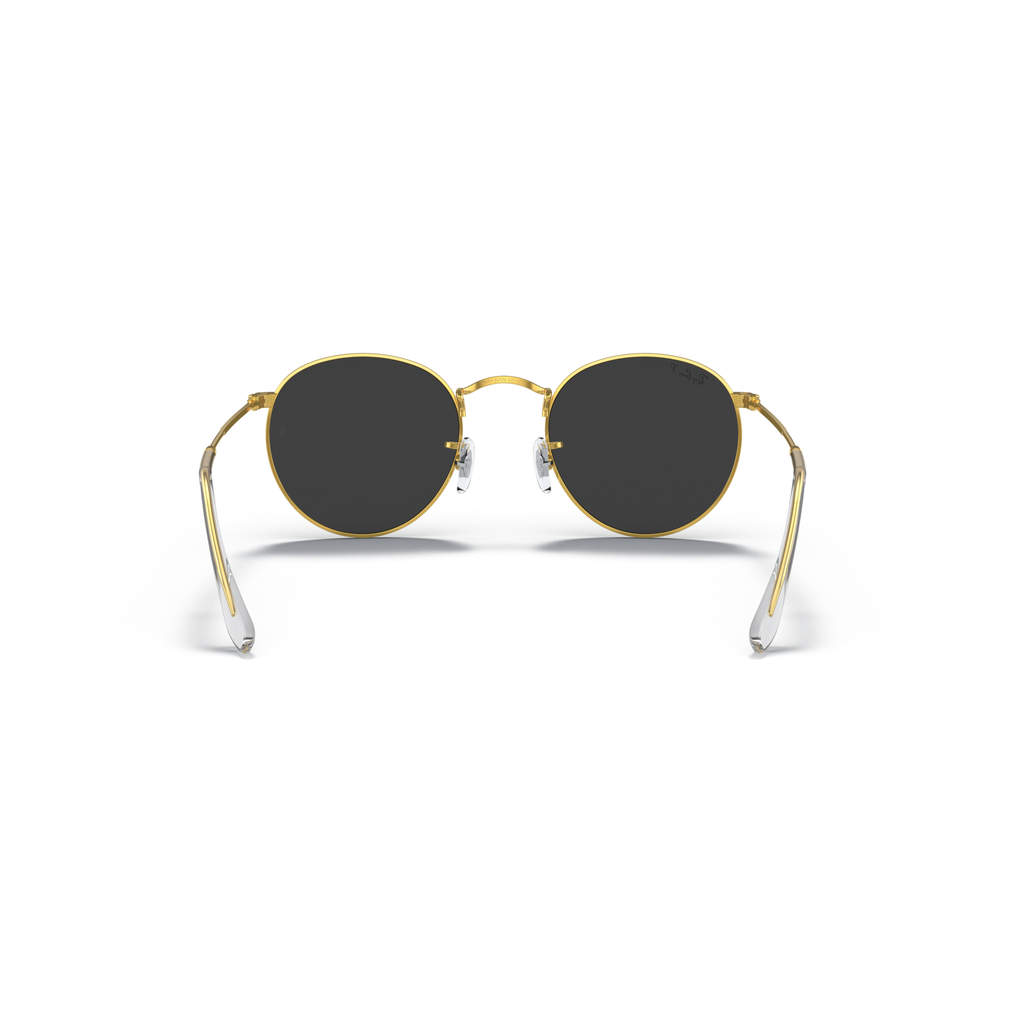 Round sunglasses with gold frame and dark lenses on a white background Polished Gold + Black Polarised