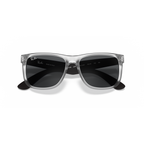Clear frame sunglasses with dark lenses on a white background Rubber Transparent + Dark Grey