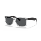 Clear frame sunglasses with black lenses on a white background Rubber Transparent + Dark Grey
