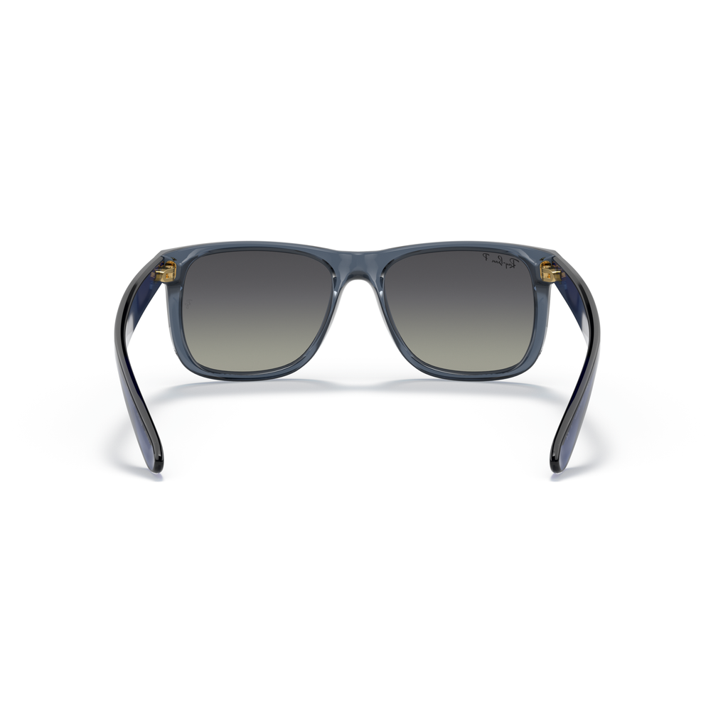 Sunglasses with blue frame and gradient lenses on a white background Polished Transparent Blue + Gradient Grey Polarised