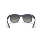 Sunglasses with blue frame and gradient lenses on a white background Polished Transparent Blue + Gradient Grey Polarised