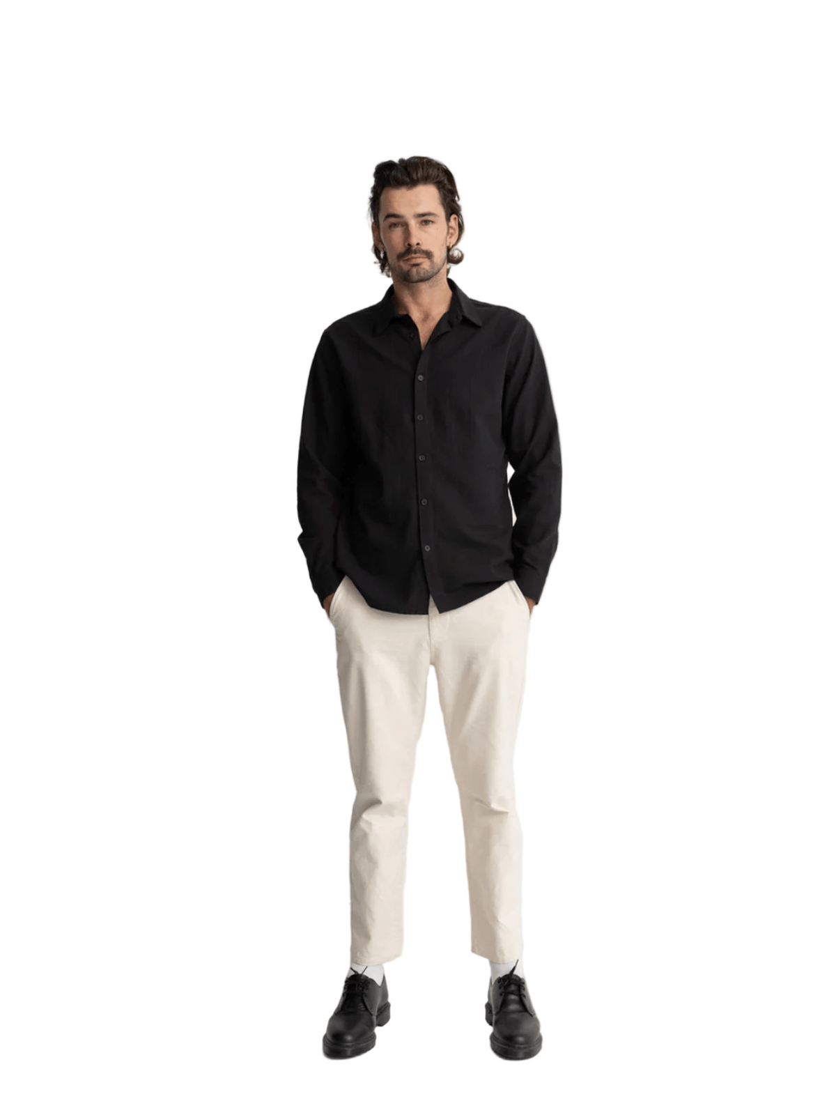 Man wearing a black shirt, white pants, and black shoes on a white background