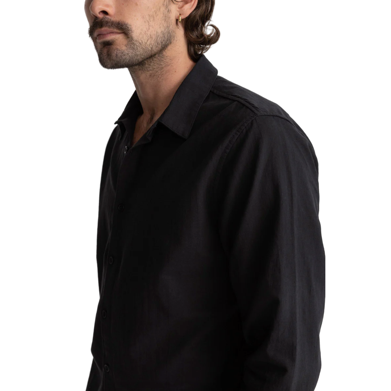 Man wearing a black shirt against a white background
