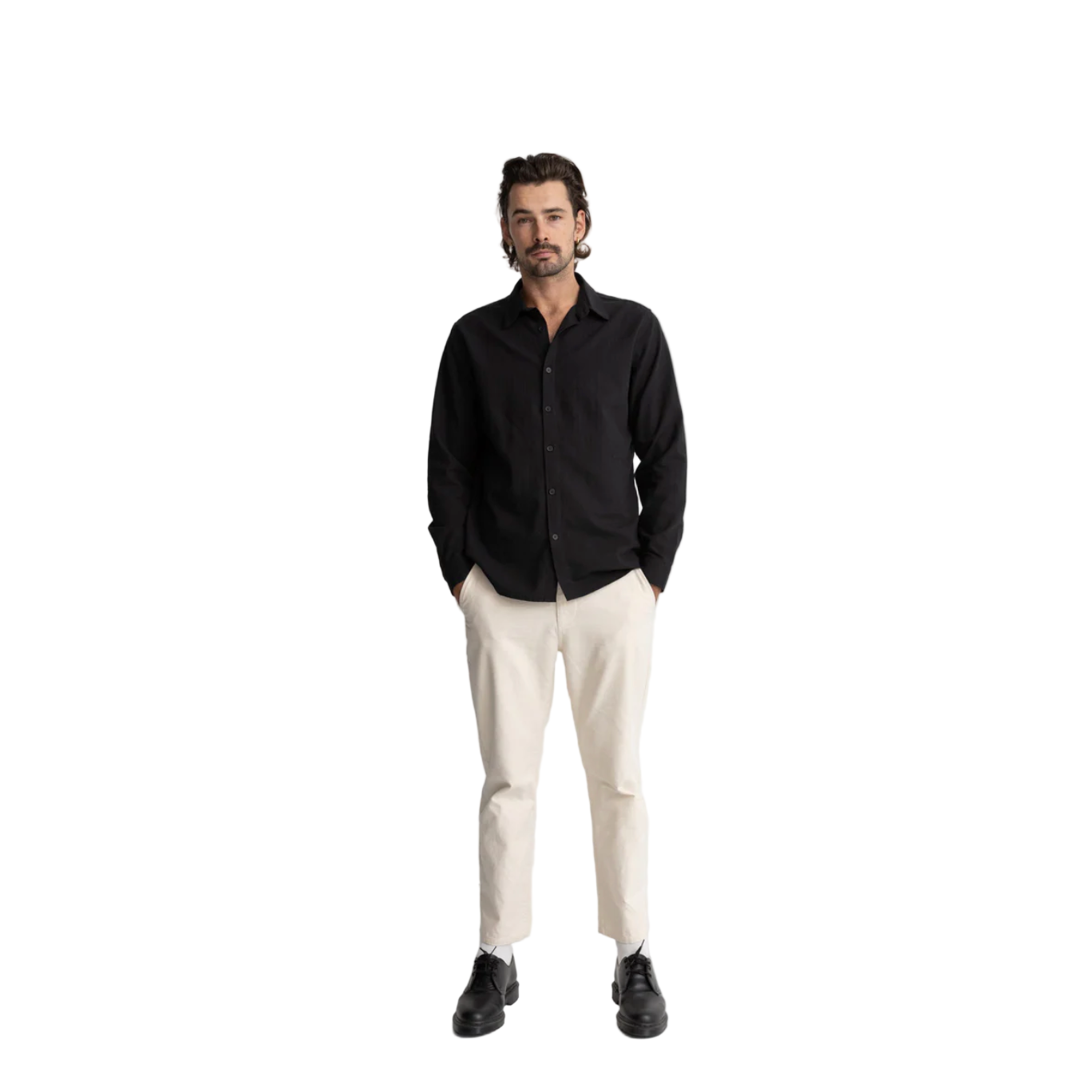 Man wearing a black shirt, white pants, and black shoes on a white background