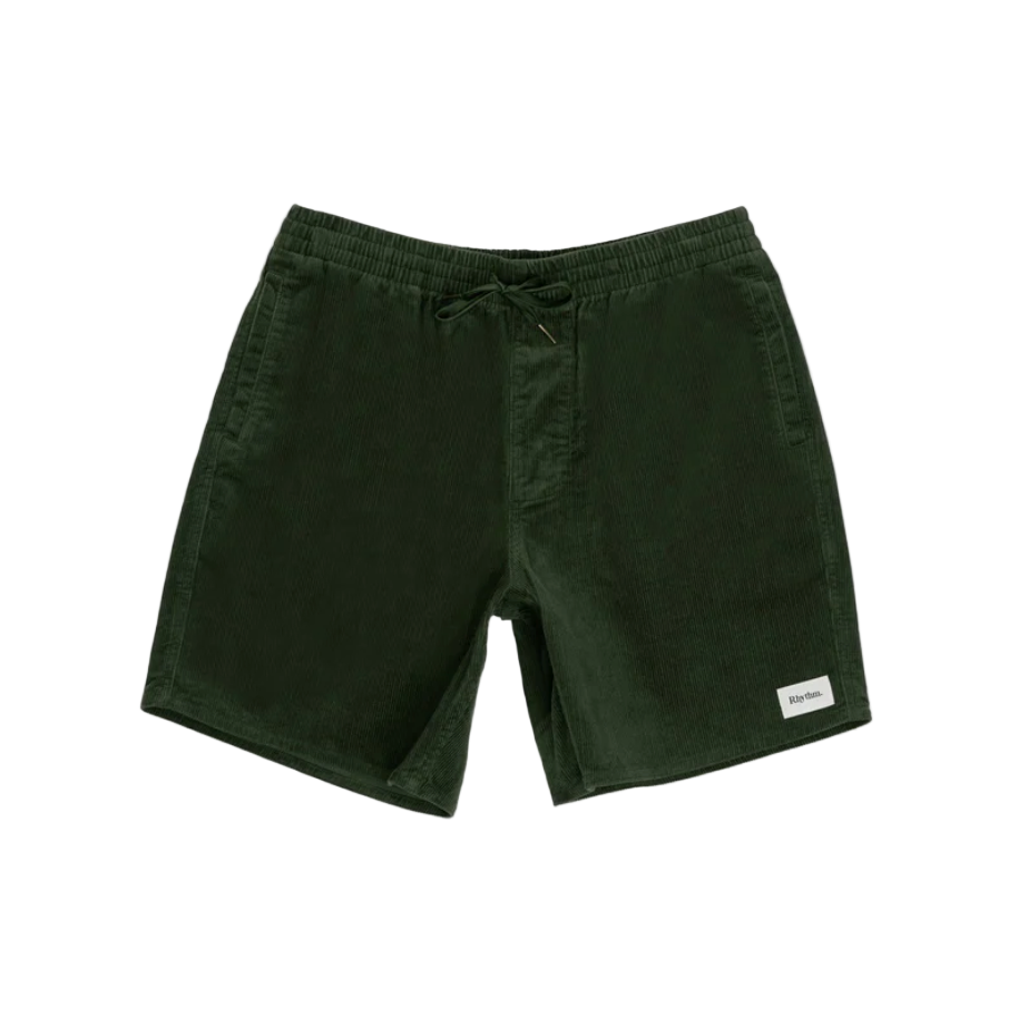 Green shorts with a brand label on a white background