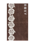 Brown towel with white floral patterns and 'ROXY' branding on a light gray background - velocity 21